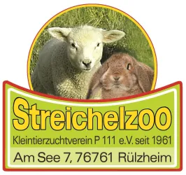 Ein Schild des Streichelzoos zeigt ein Schaf und ein Kaninchen. Der Text informiert über den Kleintierzuchtverein P 111 e.V. seit 1961 in Rülzheim.