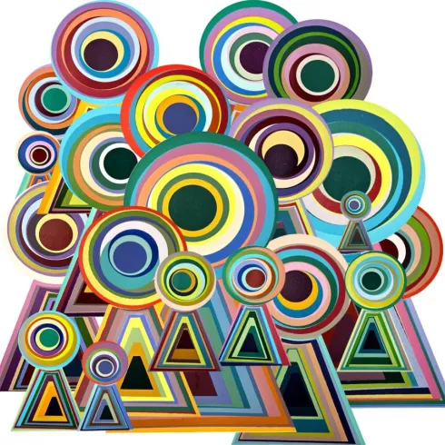 Bunte geometrische Formen in verschiedenen Größen und Farben. Kreise und Dreiecke dominieren das Bild und schaffen eine dynamische Komposition.